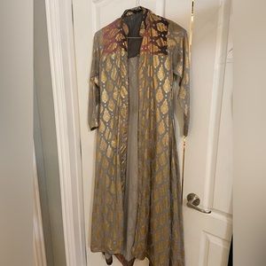 Semi formal cape. Pair it with a tank top & black ankle length slacks.